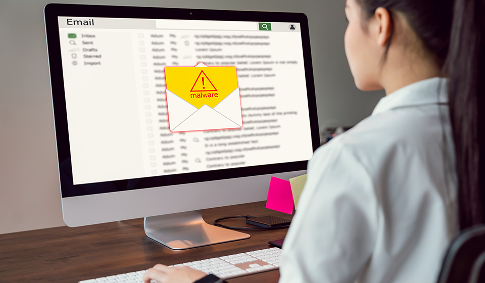 Concept of cyber crime, businesswoman using computer and show malware screen that comes with email, hack password from bank accounts and personal data.